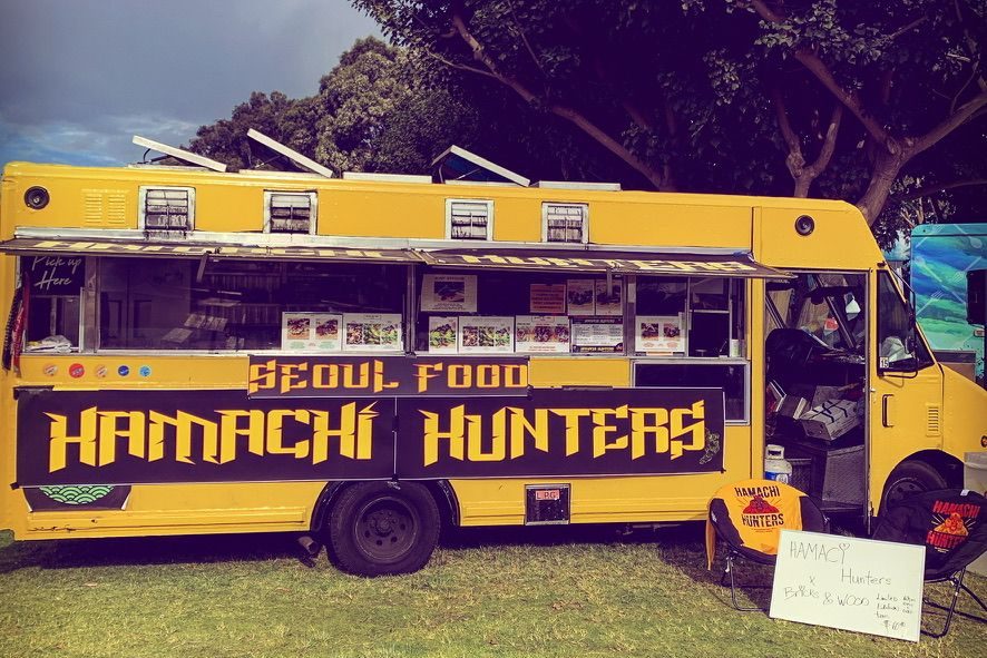 The yellow Hamachi Hunters Seoul Food bus, hatch open