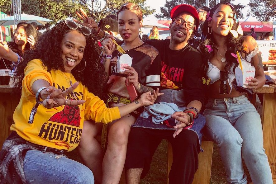 The Hamachi Hunters crew in the merch at a festival